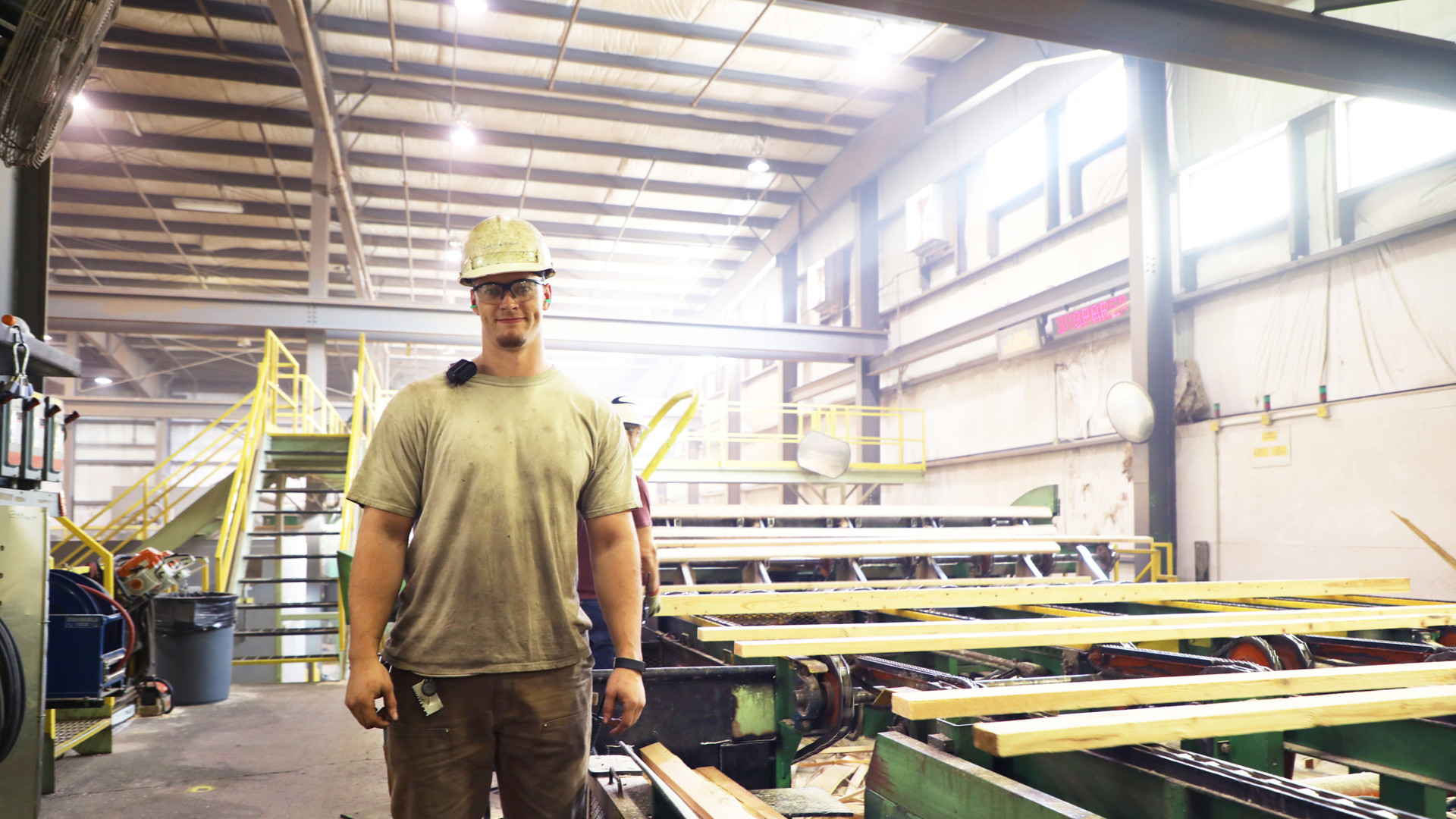 Millwright worker in a large wood processing factory